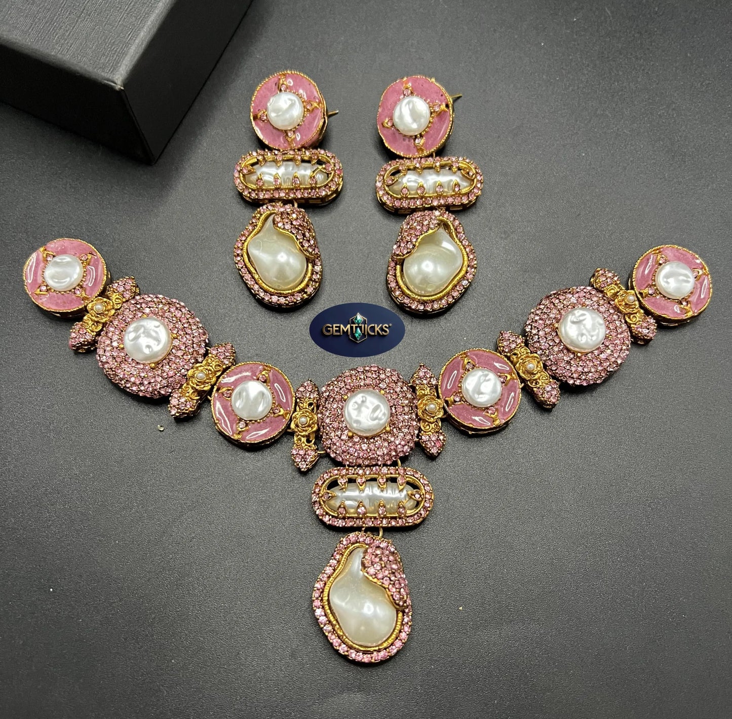 Mop Turkish Antique Polish Necklace and matching earrings with fine pink stones and Mother of Pearl censers on a dark background.