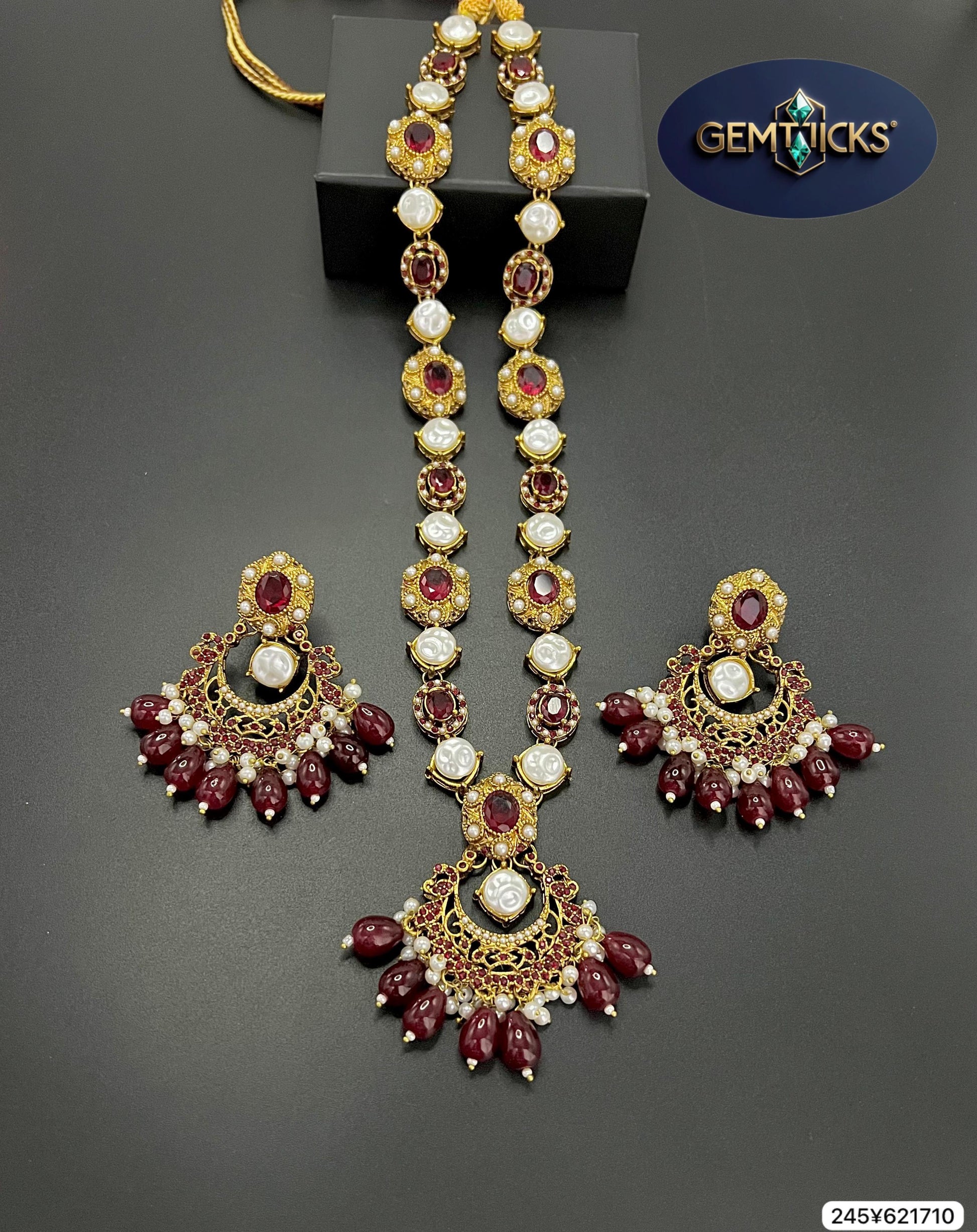 Jewelry set with necklace and earrings on a gray background, featuring the Gemtiques brand.
