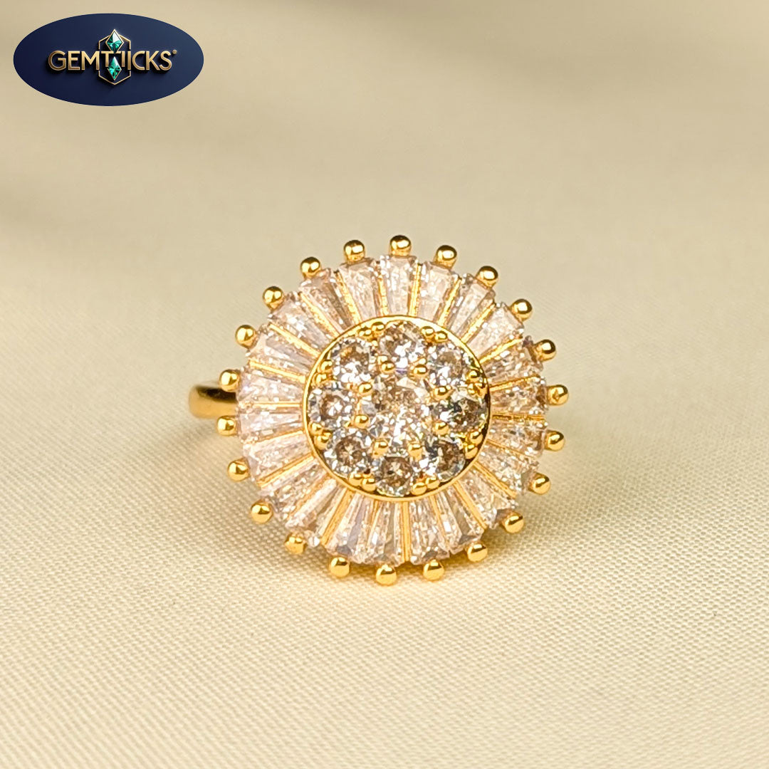 Gold ring with diamonds on a beige fabric background, featuring Gemtiques logo.